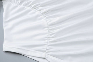 Long flared sleeve crewneck irregular solid top