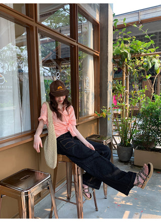 dark embroidered jeans