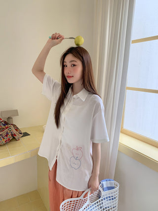 white embroidered shirt