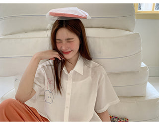 white embroidered shirt