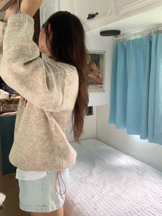 Hidden buckle pullover sweater