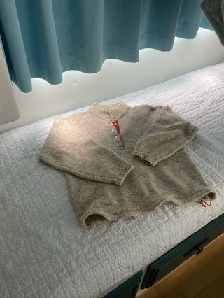 Hidden buckle pullover sweater