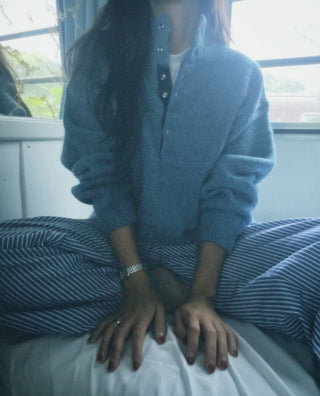 Hidden buckle pullover sweater