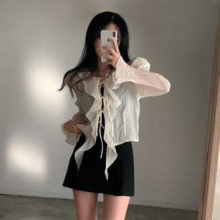 V-neck ruffled lace-up long sleeve top