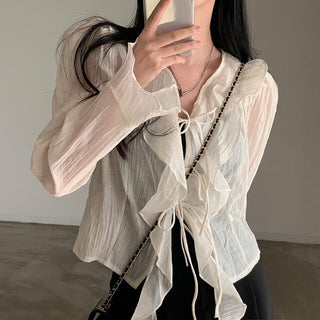 V-neck ruffled lace-up long sleeve top