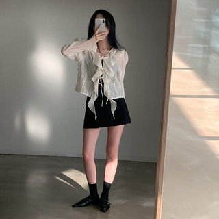 V-neck ruffled lace-up long sleeve top