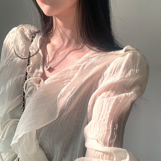 V-neck ruffled lace-up long sleeve top