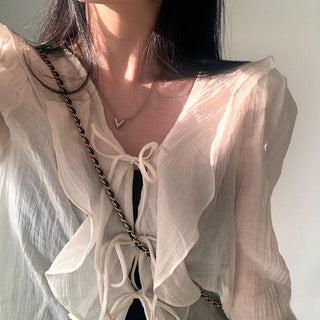 V-neck ruffled lace-up long sleeve top