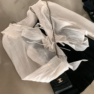 V-neck ruffled lace-up long sleeve top