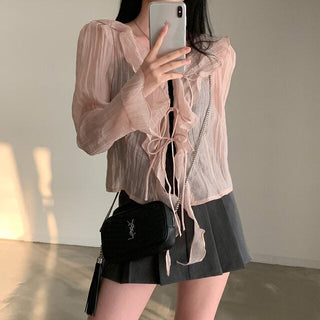 V-neck ruffled lace-up long sleeve top