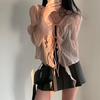 V-neck ruffled lace-up long sleeve top
