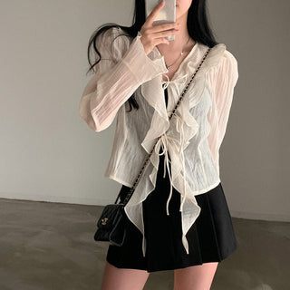 V-neck ruffled lace-up long sleeve top