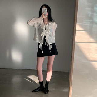 V-neck ruffled lace-up long sleeve top