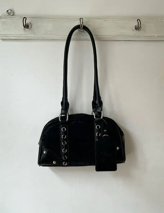 Long handle perforated shoulder bag