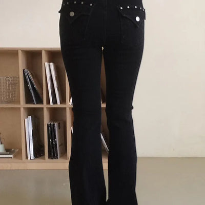 Black washed slim long bootcut denim with studded back pockets