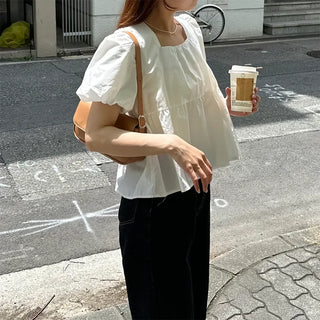 Voluminous peplum blouse