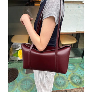 Slide pocket shoulder bag