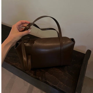 Slide pocket shoulder bag