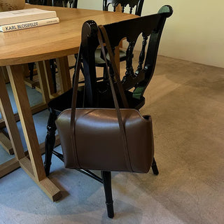Slide pocket shoulder bag