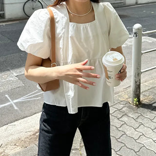 Voluminous peplum blouse