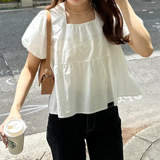 Voluminous peplum blouse