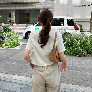 Round-button collarless half-sleeve jacket