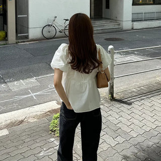Voluminous peplum blouse