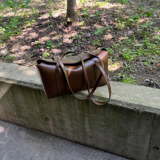 Slide pocket shoulder bag