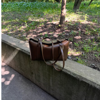 Slide pocket shoulder bag