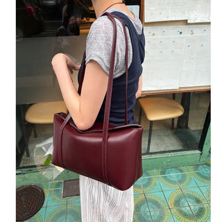 Slide pocket shoulder bag
