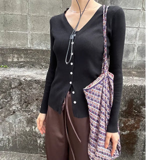 V-neck cardigan with waist-defining belt