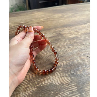 Clear brown ball necklace