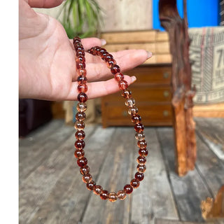 Clear brown ball necklace