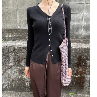 V-neck cardigan with waist-defining belt