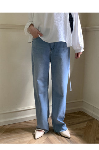 Wide-leg denim pants with cut hems