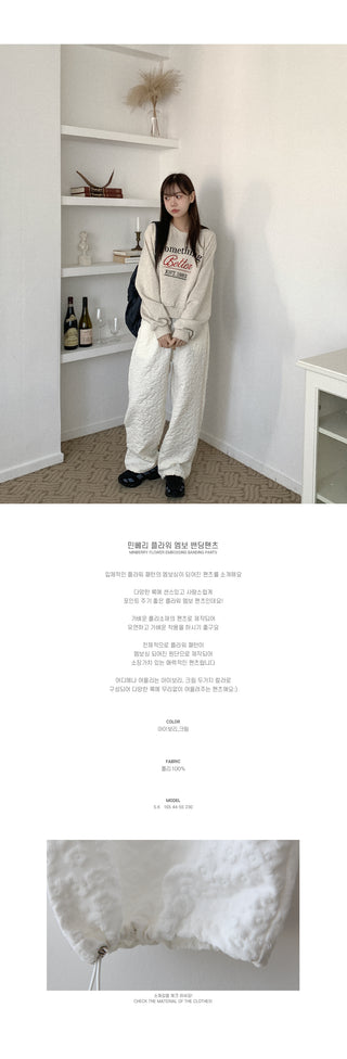 Flower embossed elastic waist pants