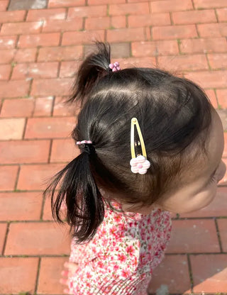 Set of mini elastic hair ties for children and girls.