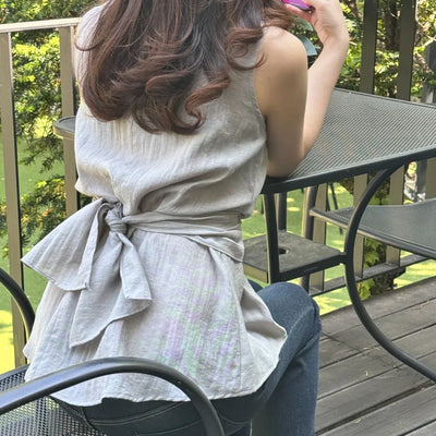 sleeveless wrap blouse