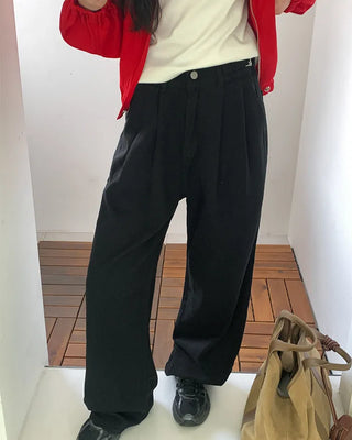 Wide-leg pants with buckle pleats