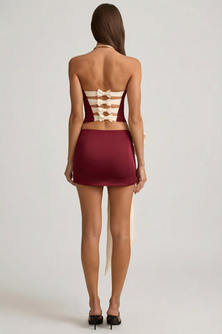 Satin Bow-Detail Low-Rise Mini Skirt in Wine Red