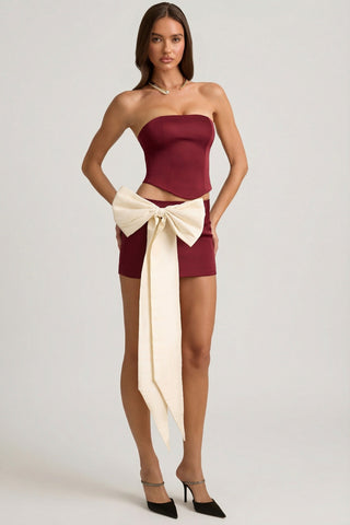 Satin Bow-Detail Low-Rise Mini Skirt in Wine Red
