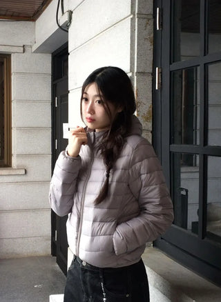 Snowy twisted cable knit hooded padded vest