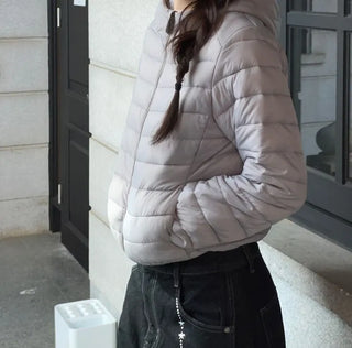 Snowy twisted cable knit hooded padded vest