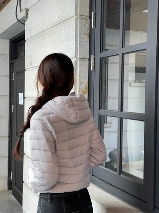 Snowy twisted cable knit hooded padded vest