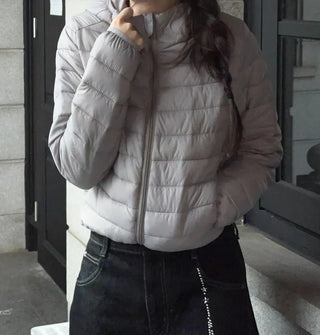 Snowy twisted cable knit hooded padded vest