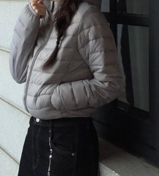 Snowy twisted cable knit hooded padded vest