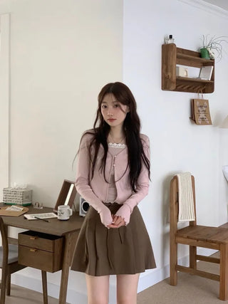 Label wave loose fit flower punching v-neck long sleeve button cardigan