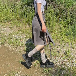 Side slit strap layered binding skirt