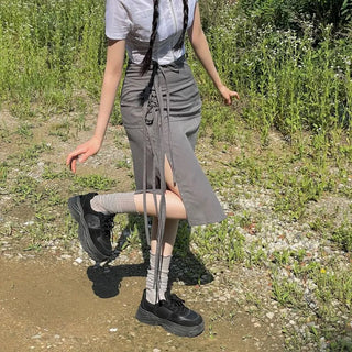 Side slit strap layered binding skirt