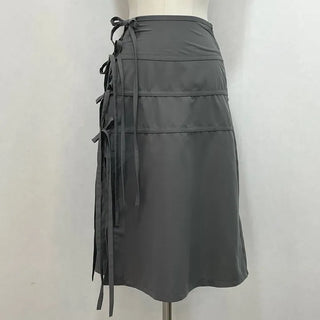 Side slit strap layered binding skirt